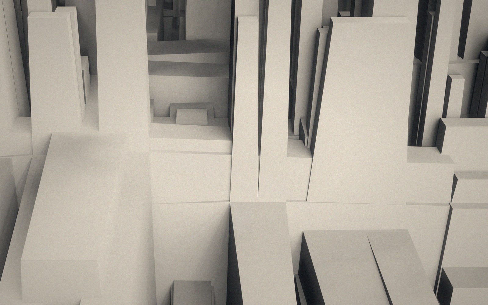 White geometric blocks arranged like an abstract miniature cityscape of towers